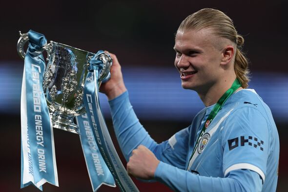 Erling Haaland raises the cup after Manchester City beat Arsenal in the Carabao Cup Final