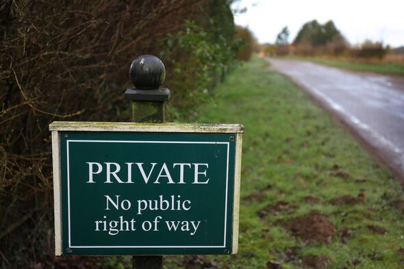 A green sign with white text stating