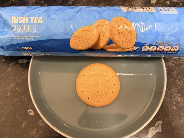 rich tea biscuit on a plate with blue packet behind it