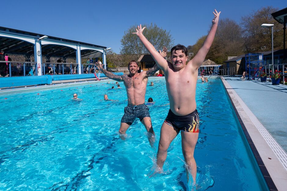 Swimmers enjoy the spring sun at Hathersage Outdoor Pool, Peak District, as temperatures are expecte