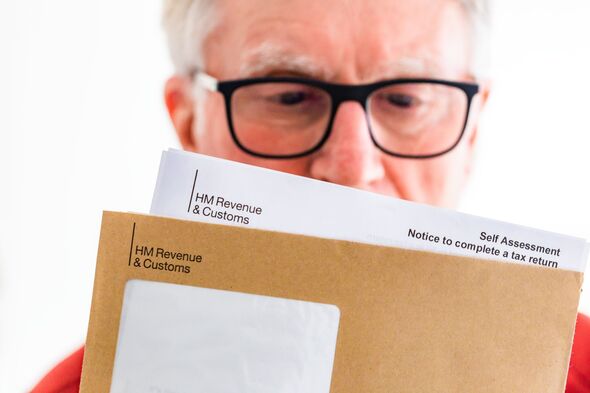 Senior man opening HMRC tax letter