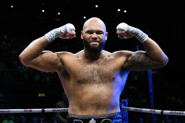 Frazer Clarke flexing in the ring