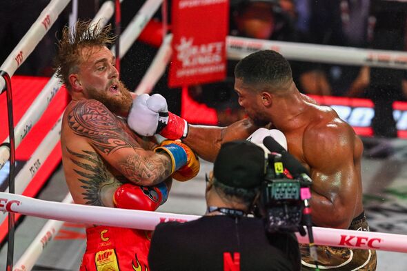 US boxer and influencer Jake Paul (L) fights British boxer Anthony Joshua in a non-title heavyweight bout at the Kaseya Center i