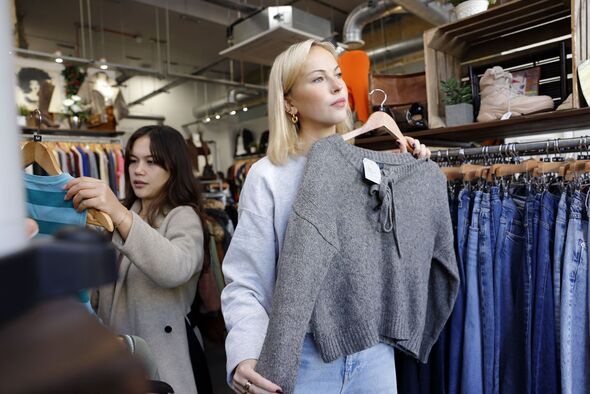 Two young women shopping in a vintage charity shop