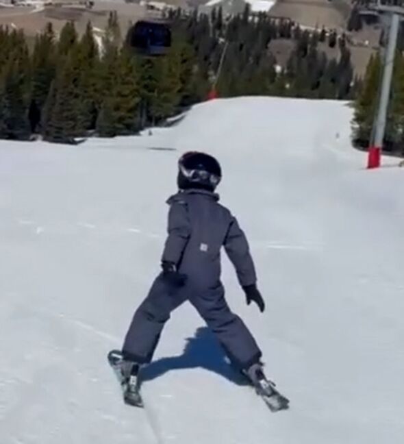 A screenshot from video showing Prince Archie skiing with Prince Harry