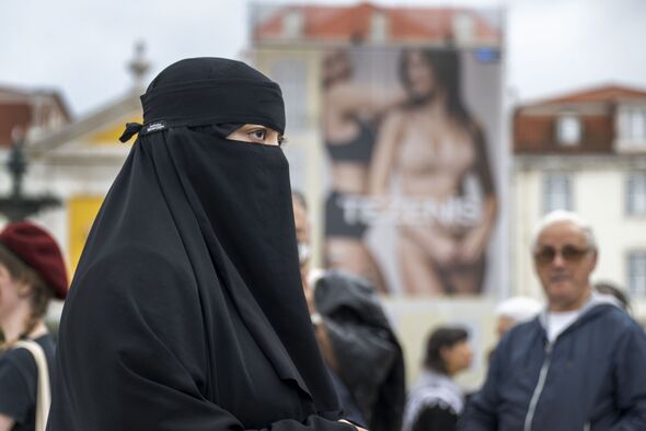 A female protester wearing a burqa seen at Rossio Square in Portugal