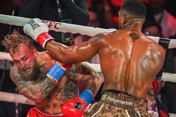 Anthony Joshua lands a blow on Jake Paul