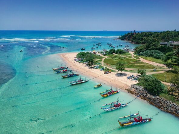 Sri Lanka beach with boats at the shore
