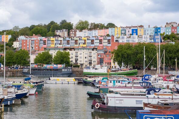 Bristol Harbourside features an inviting scene with boats docked in the water and bright buildings lining the shore