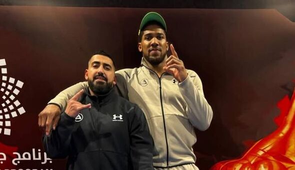Sina Ghami and Anthony Joshua pose for a photograph