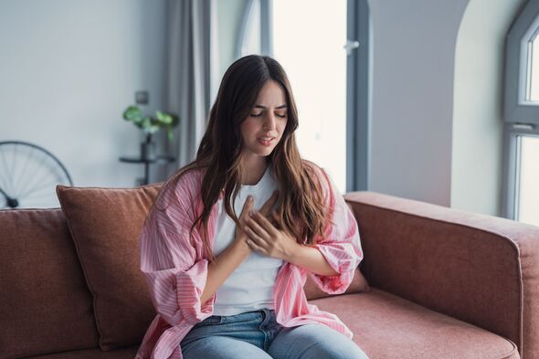 Woman experiencing chest pain