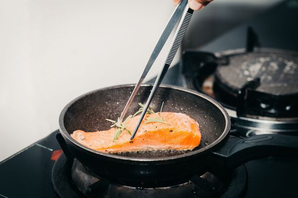 Chef Hand Pan Seared Salmon Fillet At home