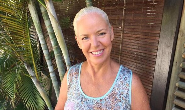 A woman smiling in the sunshine