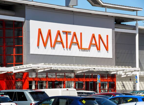 Branch of Matalan in a retail park with cars parked in the foreground