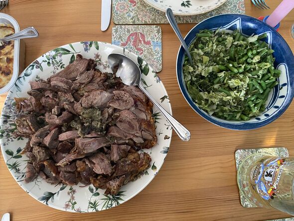 Carved lamb and green vegetables in plates