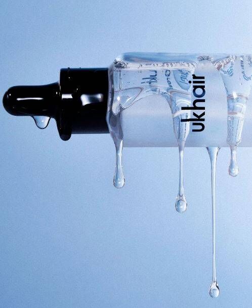 bottle of serum spilling on its side