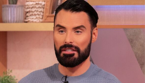 Close up of Rylan Clark looking serious