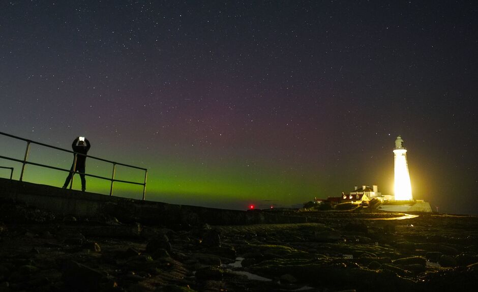 The Northern lights are visible over St Mary's lighthouse in Whitley Bay.
