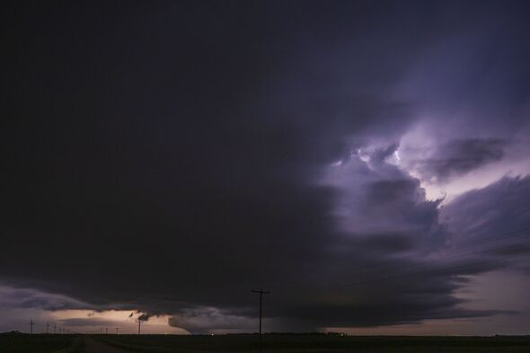 Fully Developed Wedge Tornado on the Ground after Sunset with Lightning in the Supercell
