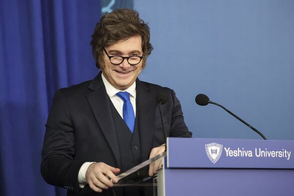 President Milei wearing glasses during speech