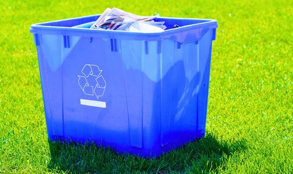 Picture of a newspaper in a recycling bin