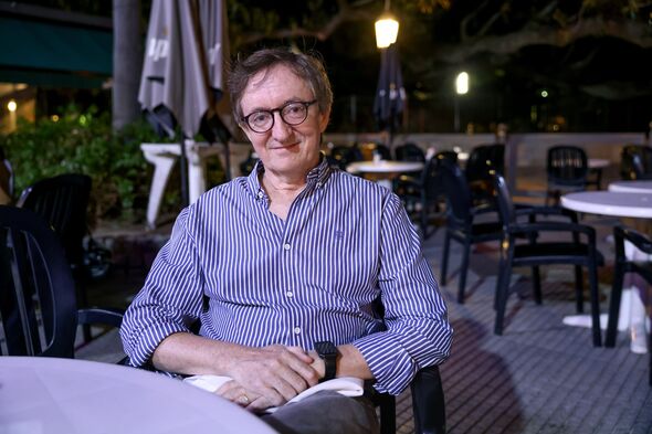 Bruce Thompson sat at restaurant table