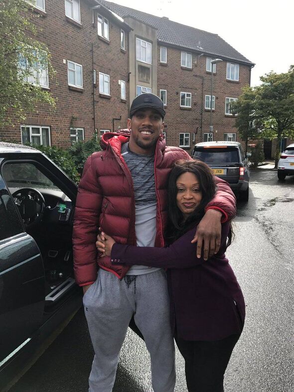 Anthony Joshua, with his left arm around his mother, Yeta Odusanya