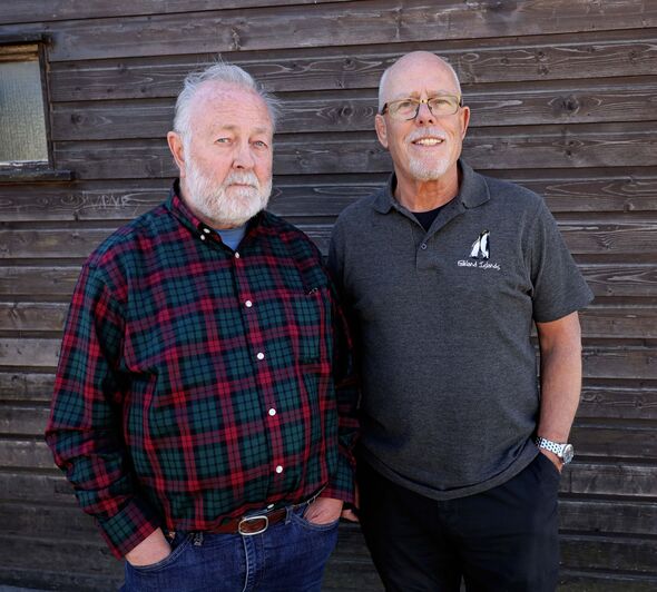 Chris Anderson stand with David Cummins