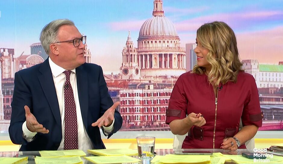 Ed Balls and Susanna Reid talking to each other animatedly as they sit behind the Good Morning Britain