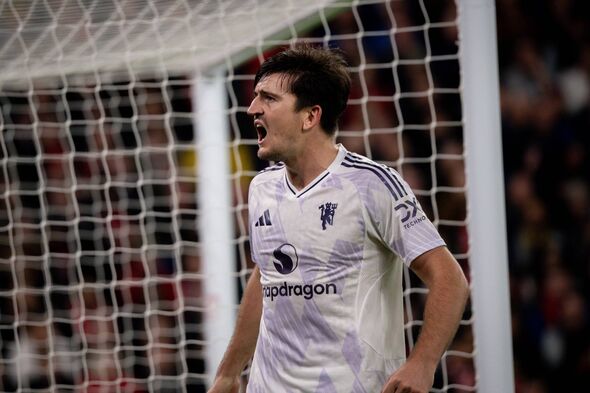 Harry Maguire of Manchester United celebrates scoring a goal to make the score 1-2 during the Premier League match between Live
