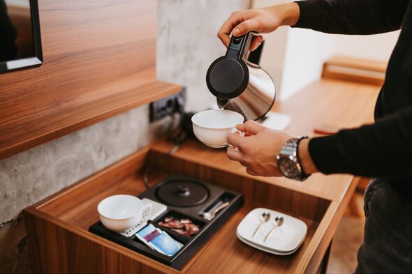 Preparing cups of tea in hotel
