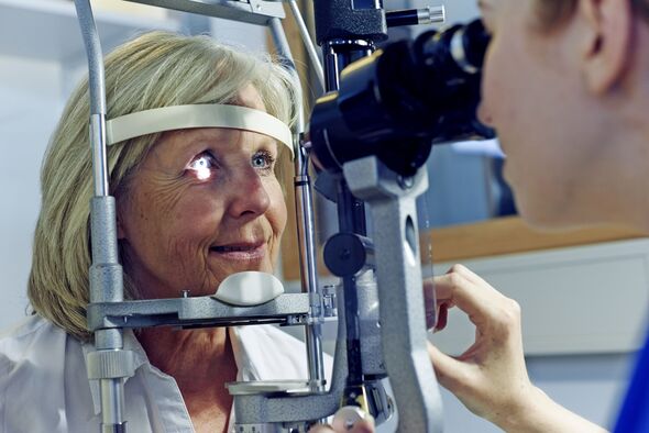 Female patient having eye tested in hospital