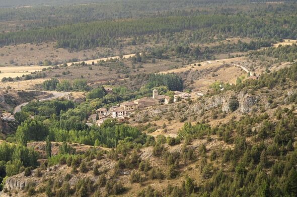 Lobos river canyon village and church in soria, spain