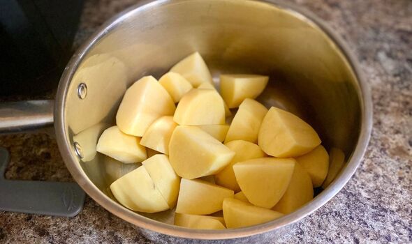 Chopped maris piper potatoes in pan