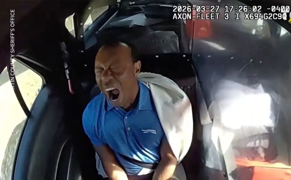 Handcuffed Tiger Woods looks irritated in cop car after rollover crash, DUI arrest