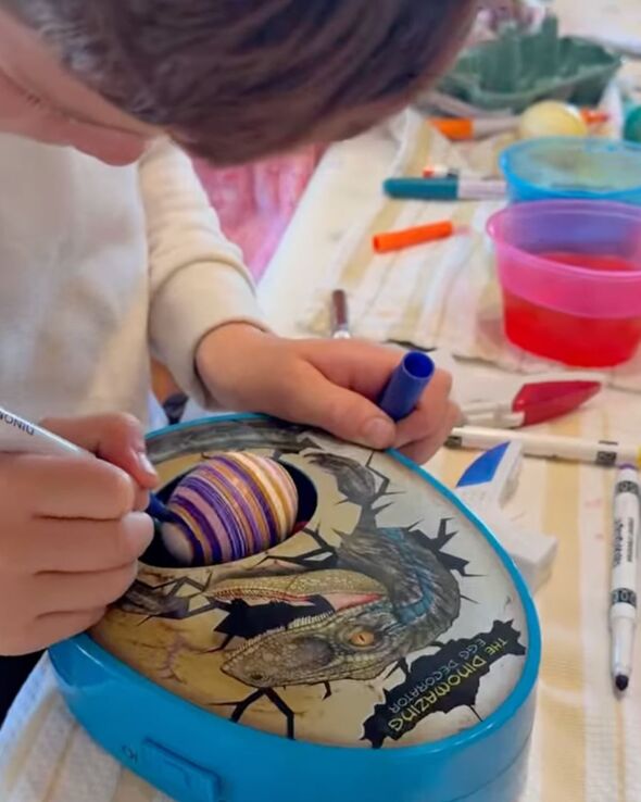 Archie paints an Easter egg