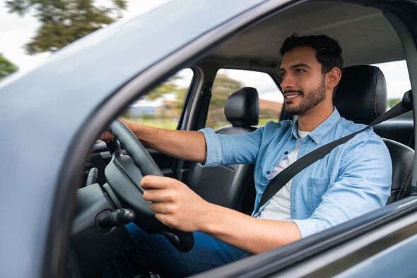Happy man driving his car