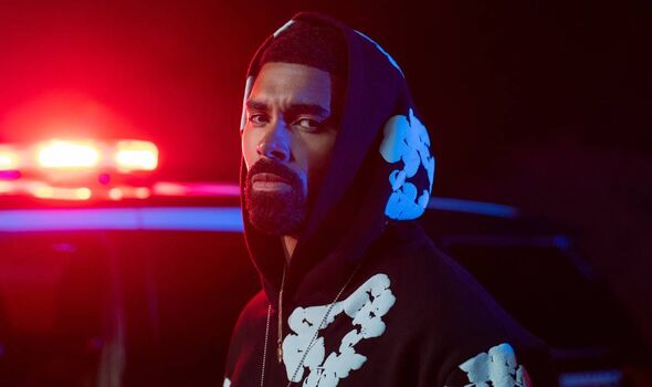 Bearded man wearing a hoodie.