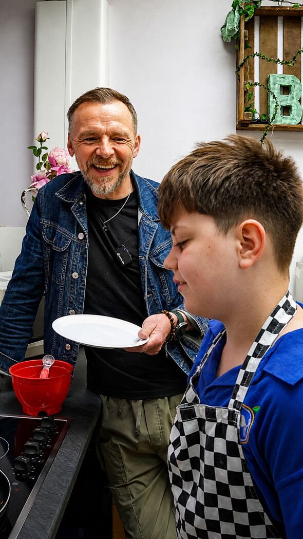 Actor Simon Pegg helps out at school.