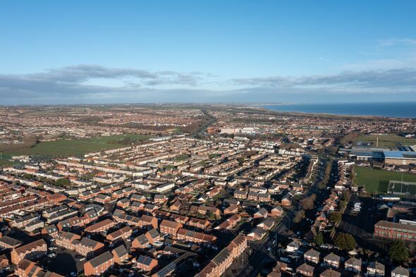Aerial drone photo of the town of Hartlepool in the UK showing rows of terrace houses and homes and typical British suburban housing estates with the
