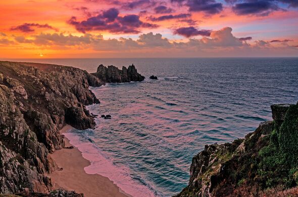 Sunrise over logan rock near pedn vounder beach, treen ,cornwall. (Photo by: Kevin Britland/Universal Images Group via Getty Ima