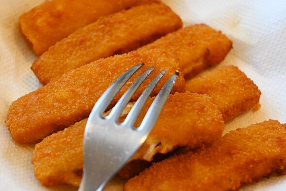 Fried fish sticks on paper towel quick meal time saving home cooking concepts