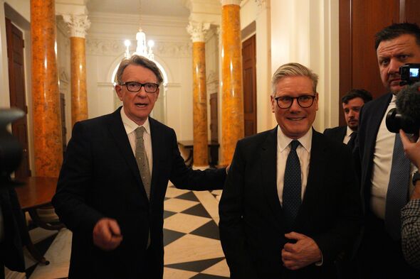 Peter Mandelson puts his hand on Starmer's back