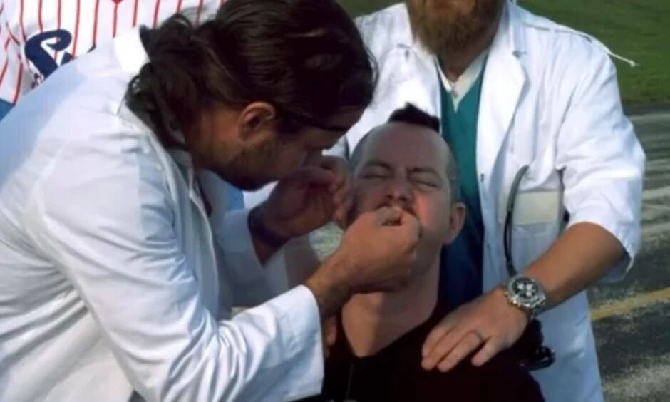 Ehren McGhehey being medically assessed