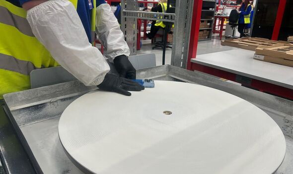 A phone screen being repaired
