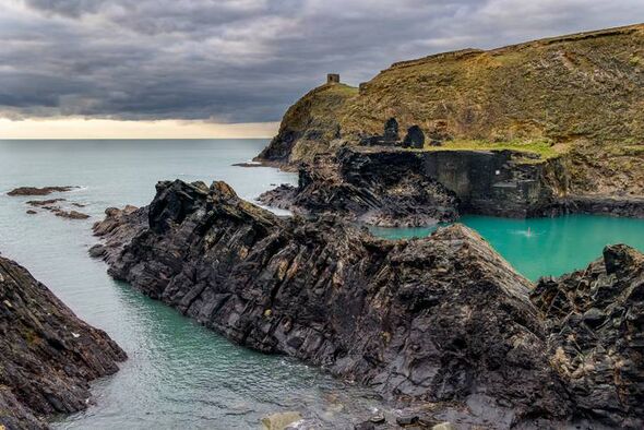 Dramatic coastline and moody sunset skies at the Blue Lagoon near Abereiddy at Pembrokeshire, Wales, UK
