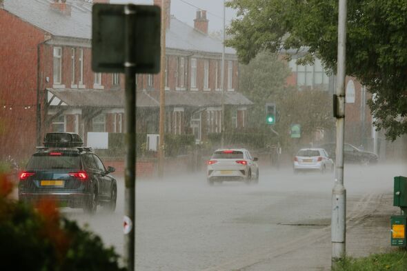 Heavy rain storm on a suburban road in England