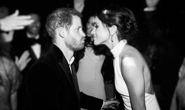 Harry puckers lips in front of Meghan