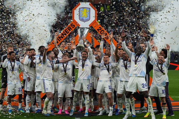 Aston Villa players lift the UEFA Europa League trophy after