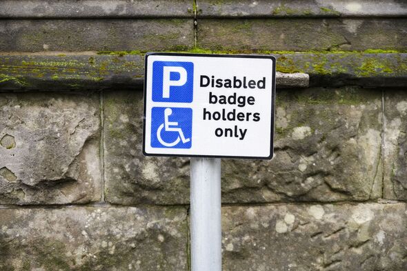 Disabled blue badge holder parking sign for driver